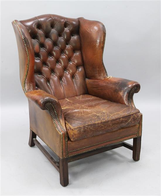 A Georgian style mahogany wing armchair, H.3ft 6in.